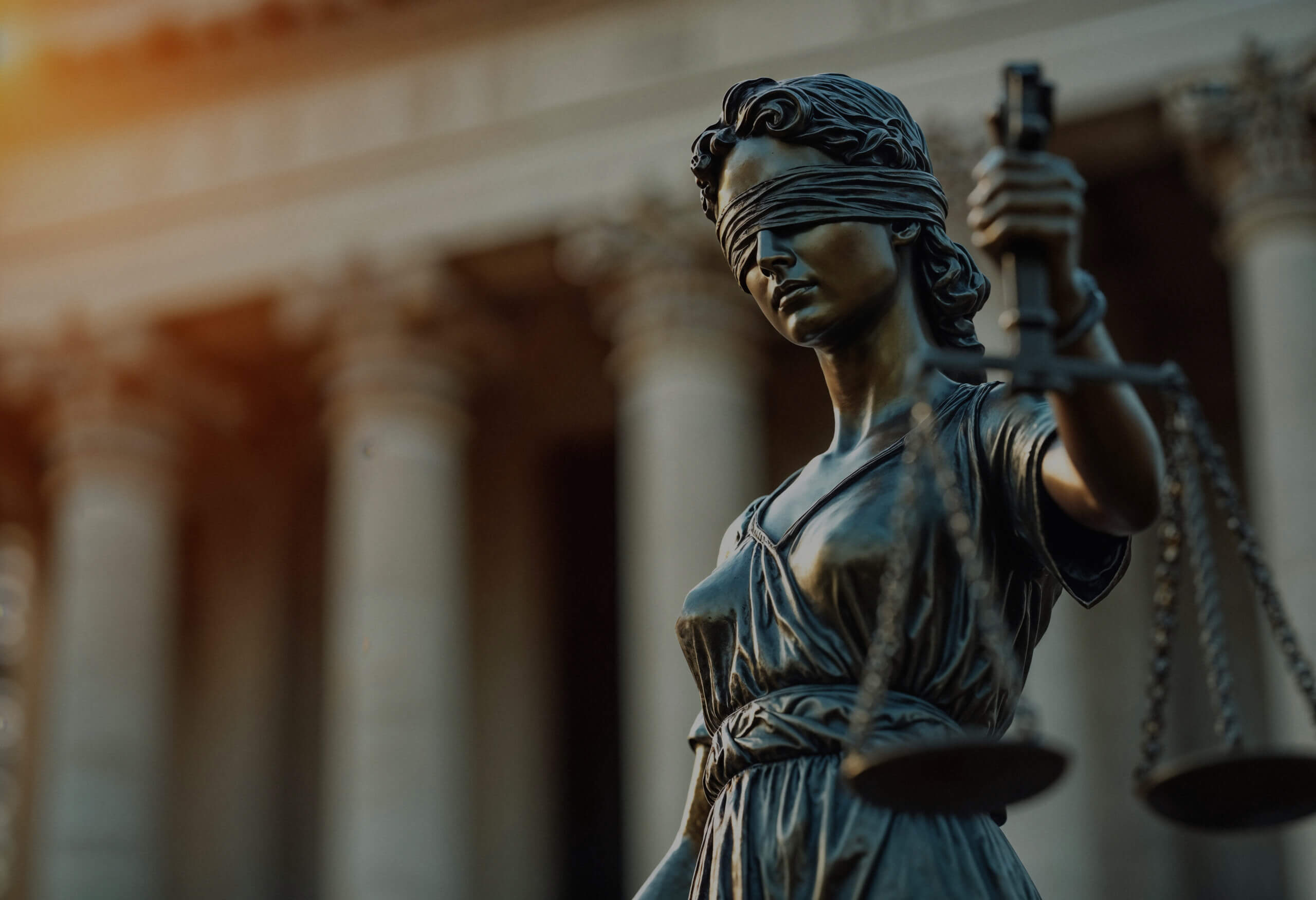 close up justice statue scaled black